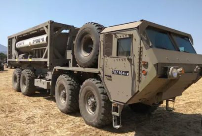 A heavy tactical transport vehicle in the field